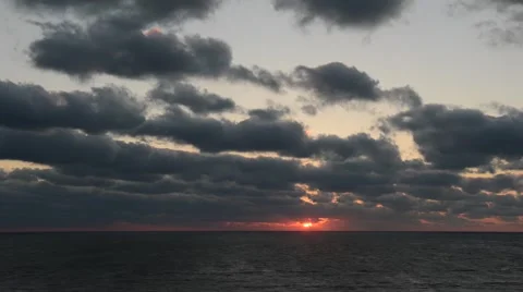 Sunrise over sea, dramatic clouds, time lapse Stock Footage 51142373