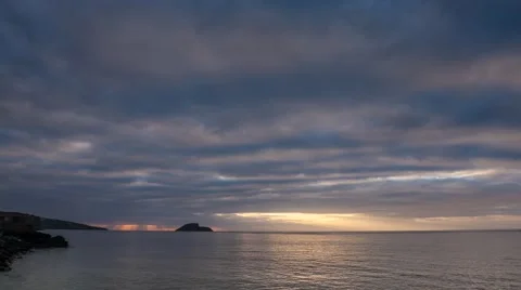 Sunrise over the sea with heavy clouds, 4K time lapse Stock Footage 42570108