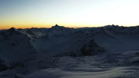 Sunrise Over the Snow Capped Caucasus Mountains in Russia Video stock 320856295