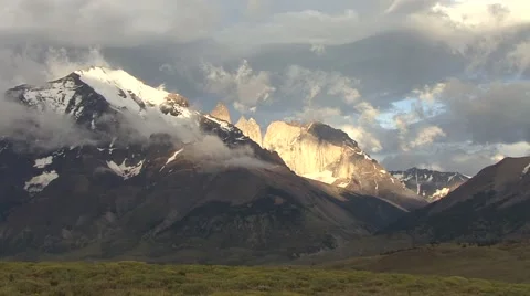 Sunrise over snowy dramatic mountains in the horizon Video stock 56869675