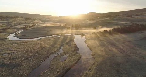 Sunrise over a still river Stock Footage 119842259