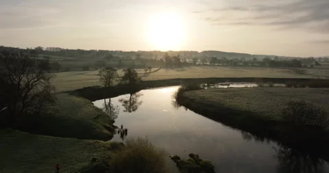 Sunrise over a still river Stock Footage 276162997