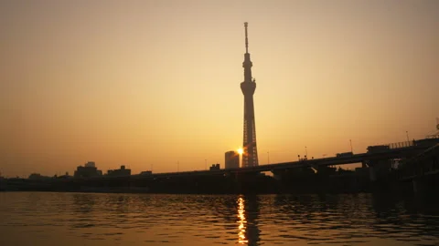 Sunrise over the Sumida River Terrace and Tokyo Skytree Stock Footage 332791523