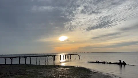 Sunrise over Tagus River, cloudy morning, ship wreck, pear Stock Footage 245906773