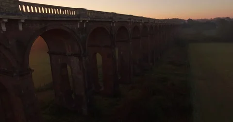 Sunrise over train bridge drone shot Stock Footage 68933646
