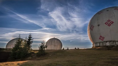 Sunrise over uniquely designed old radar station in shape of white spheres. Stock Footage 121770226