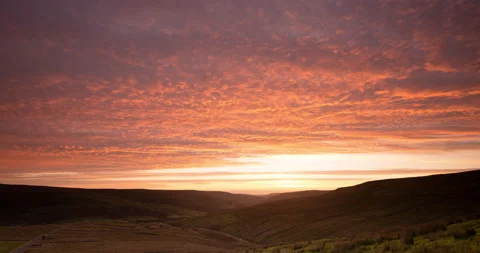 Sunrise over a valley Stock Footage 166725995