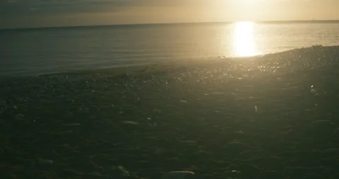 Sunrise over the water at Easington beach #1 - 4K Footage Stock-Footage 270167807