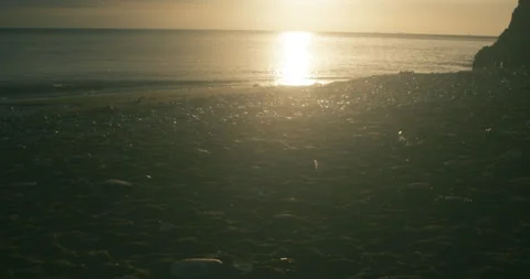 Sunrise over the water at Easington beach #3 - 4K Footage Stock-Footage 270167996