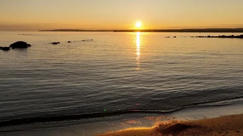 Sunrise over the water, orange sky and calm lake Stock Footage 256942353