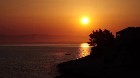 Sunrise part 3 with a boat. Taken from my terrace in Croatia Stock Footage