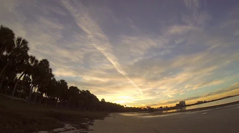 Sunrise rays along beach shoreline Stock-Footage 34235387
