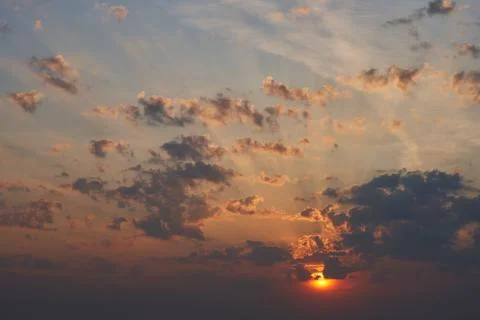 Sunrise with rays breaking through the clouds Stock Photos