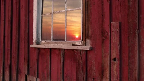 Sunrise reflected in a window in an old abandoned house in the Sutro Ghost Town Stock Footage 201185108