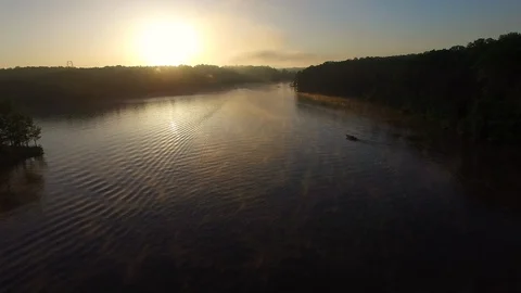 Sunrise Reflecting off Lake #2 Stockbeeldmateriaal 128528028