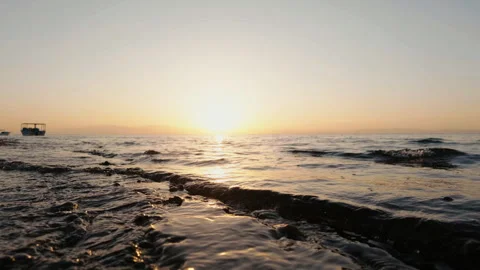 Sunrise Reflecting on Ocean Waves at Water Level, Red Sea Egypt Stock Footage 343322926