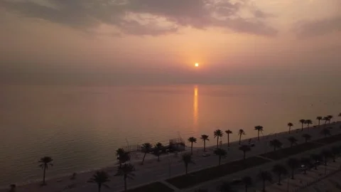 : Sunrise Reflection on the Arabian Gulf at Al Khobar Baywalk Stock Footage 336632265