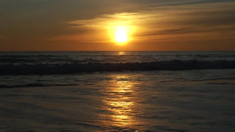Sunrise to reflection on the beach Stock Footage 155728165