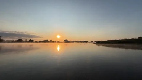 Sunrise Reflection on Calm River with Morning Mist Video stock 342316935