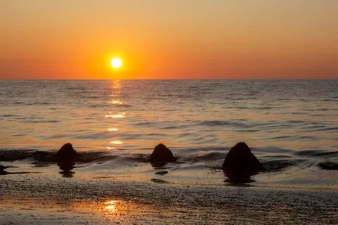 Sunrise with a reflection. Stock Photos