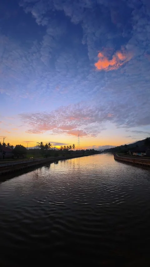 Sunrise Reflection on River. Timelapse Stock Footage 307299147