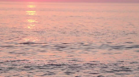 Sunrise reflections and waves on water Stock Footage 36753148
