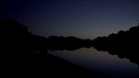 Sunrise on the River with Calm Waters Stock Footage 293892585
