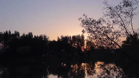 Sunrise on the river in the forest. Timelapse Stock Footage 136146444