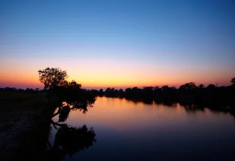 Sunrise on river Stock Photos