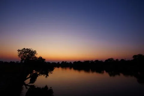 Sunrise on river Stock Photos