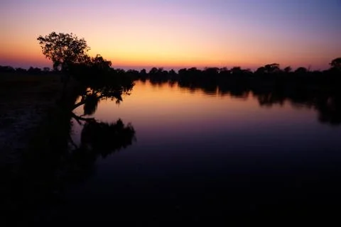 Sunrise on river Stock Photos