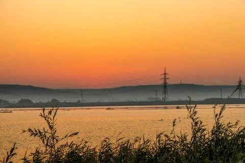 Sunrise at the river Stock Photos
