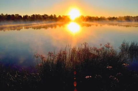 Sunrise on the river Stock Photos