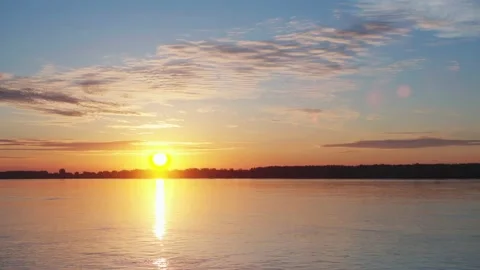 Sunrise at the river with some clouds 4 動画素材 130456557