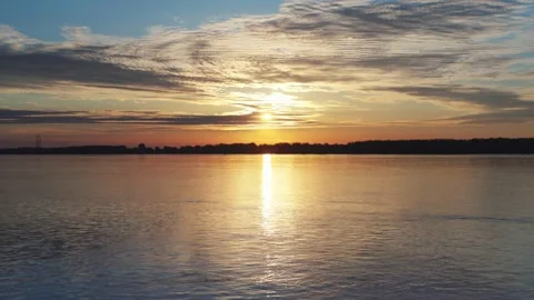 Sunrise at the river with some clouds 6 動画素材 130456659