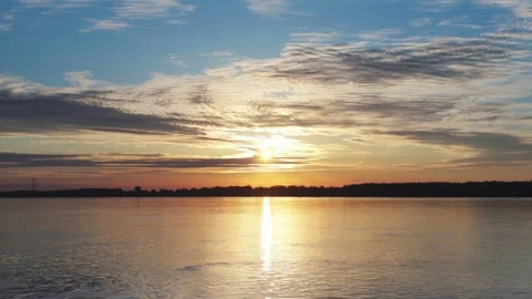 Sunrise at the river with some clouds 7 Vídeo Stock 130456681