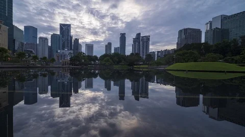 Sunrise scene with moving clouds dramatically over Kuala Lumpur city landmark Stock Footage 105087786