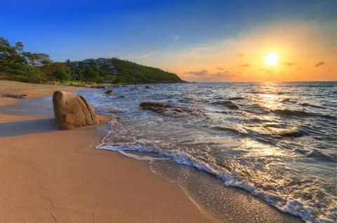 Sunrise on sea coast Stock Photos