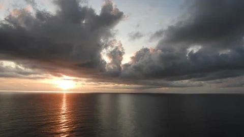 Sunrise at sea with dark clouds Stock Footage 202152054