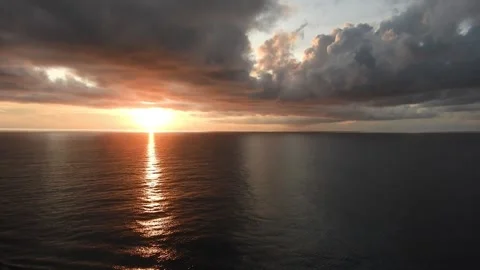 Sunrise at sea with dark clouds Stock Footage 202152061