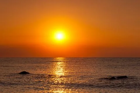 Sunrise at sea Stock Photos