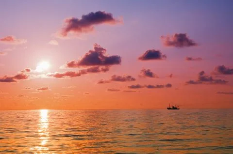 Sunrise at sea Stock Photos