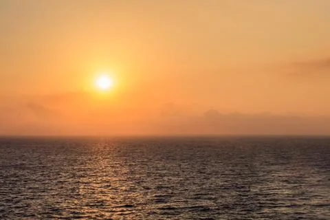 Sunrise at sea Stock Photos