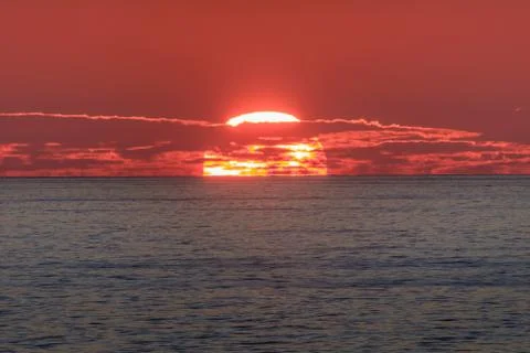 Sunrise at sea Stock Photos