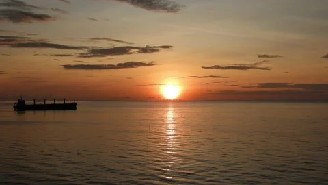 Sunrise sea - ship foreground - 4K Stock Footage 206840339