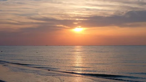 Sunrise at sea in summer or spring, clouds visible, sky, water Stock Footage 296090404