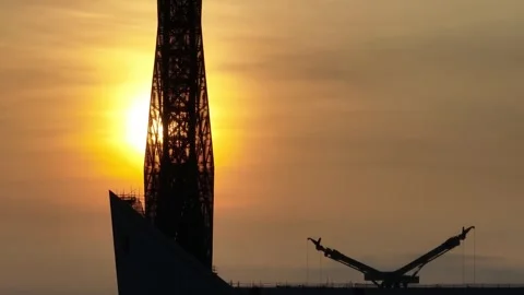 Sunrise shining through the Merdeka 118 tower Stock Footage 247860832
