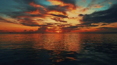 Sunrise shot of beautiful colours reflection on the clouds and  to the lagoon in Stock-Footage 136901735
