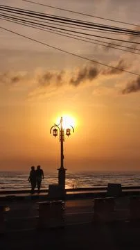 Sunrise on the side of the road forms a beautiful silhouette Stock Photos