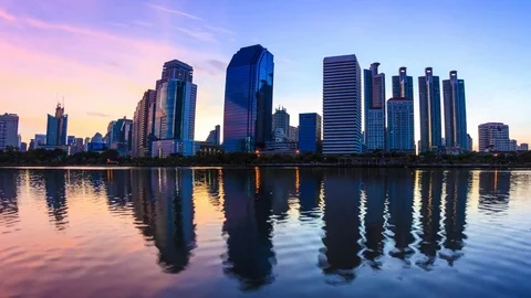 Sunrise Silhouette Building and Reflection On Water 4K Time Lapse (pan shot) Stock Footage 80286672